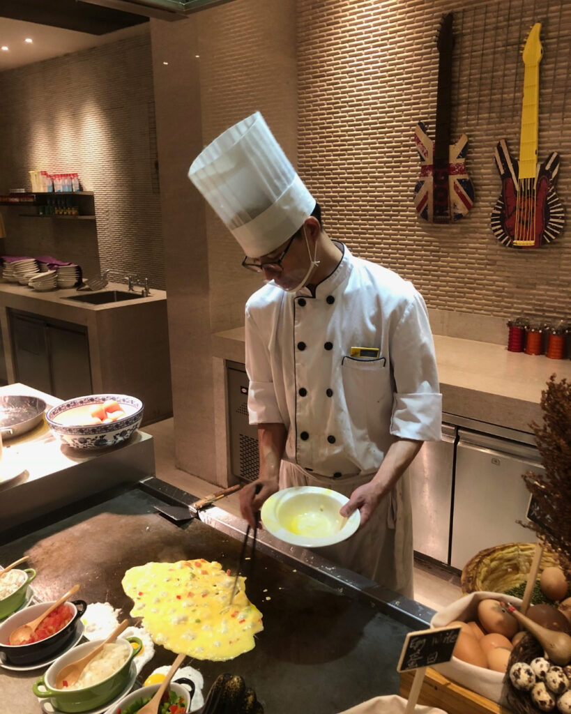 Chef cooking omelet for breakfast in China