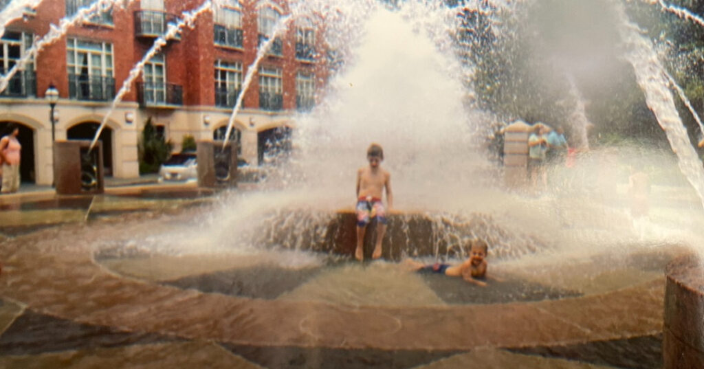 multigenerational family weekend in Charleston, fountain and two boys