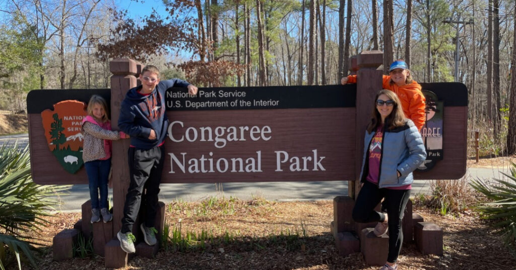 A Fun Day at Congaree National Park with kids, family at national park sign