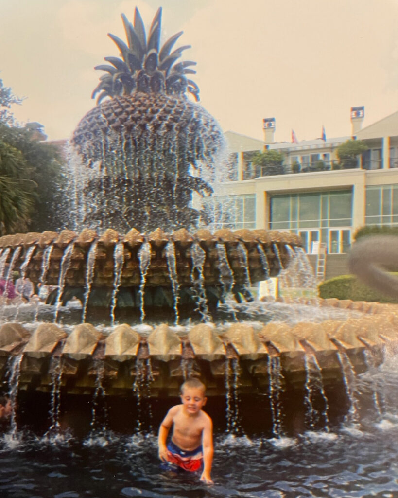 multigenerational family weekend in Charleston, boy in pineapple fountain