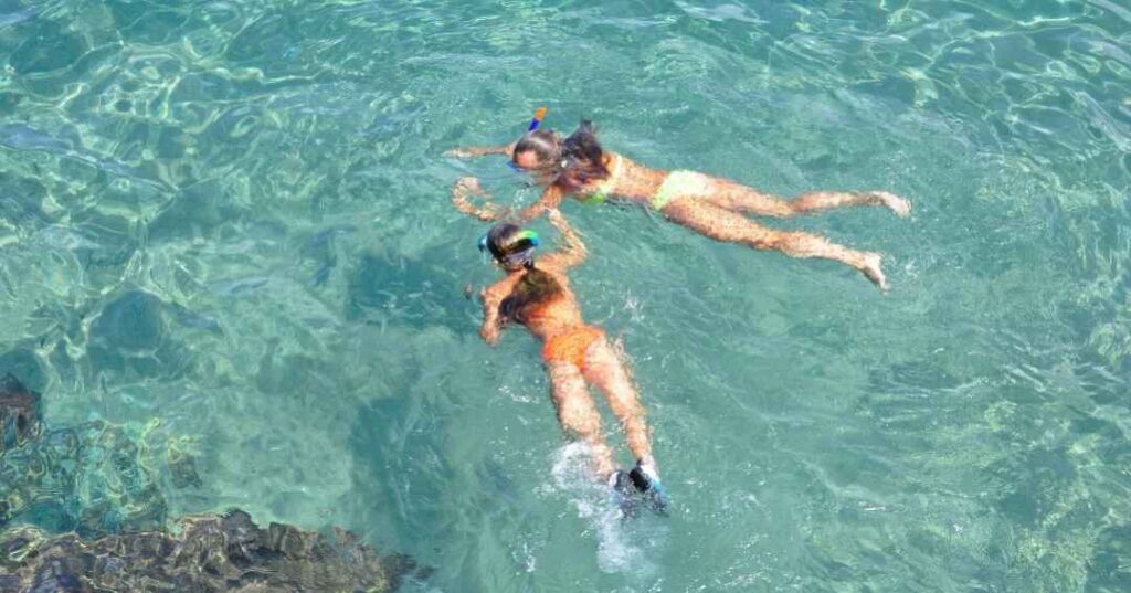 best beaches Nassau, girls snorkeling